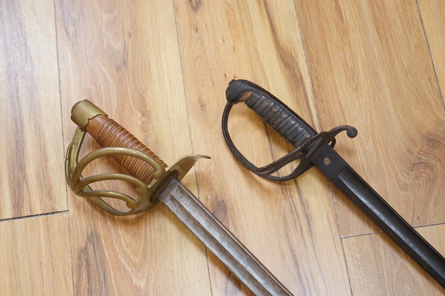 A Victorian Royal Artillery officer’s sword in poor condition and a copy of a French 1813 Cuirassier’s sword (2)